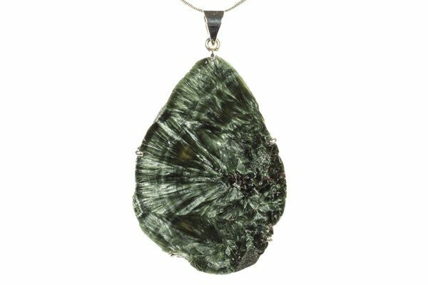 Polished seraphinite that has been crafted into a pendant.